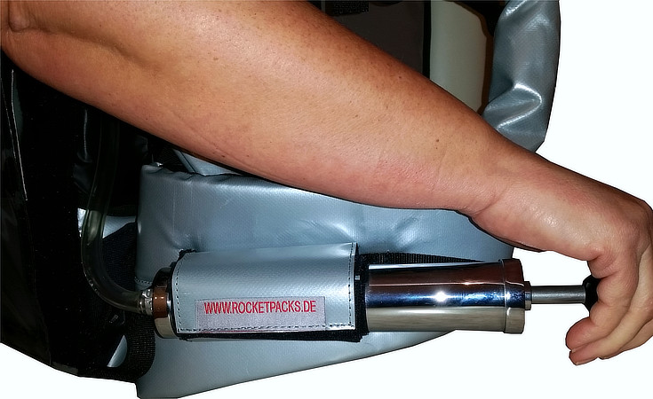 Manual hand pump for pressure-assisted beverage dispensing from a Rocketpacks drink backpack