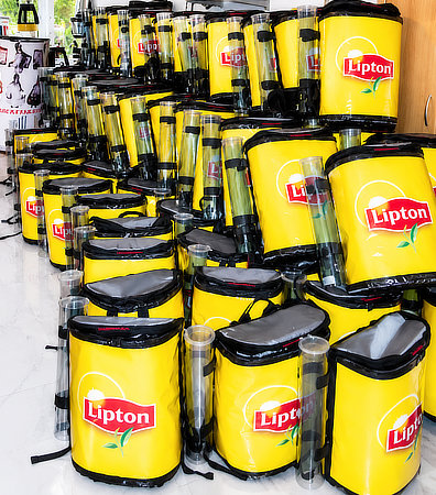 Large quantity of branded beverage backpacks for promotional events