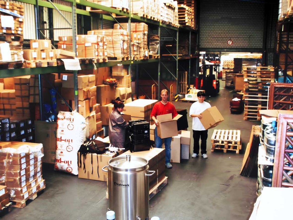Rocketpacks warehouse with beverage dispensing equipment and staff preparing orders for shipment